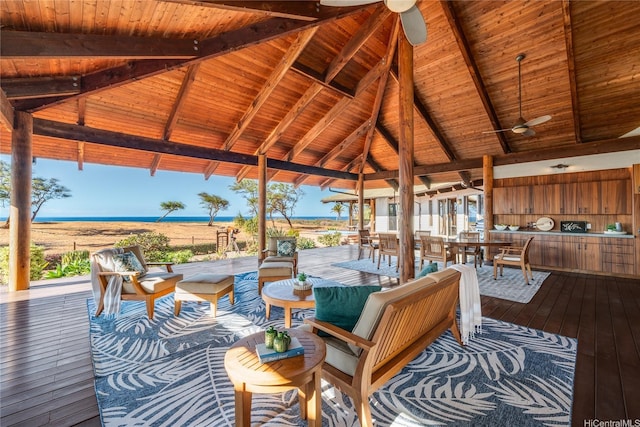 view of patio with a gazebo, a ceiling fan, and a water view