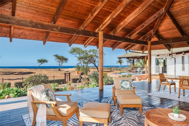view of patio with a deck with water view
