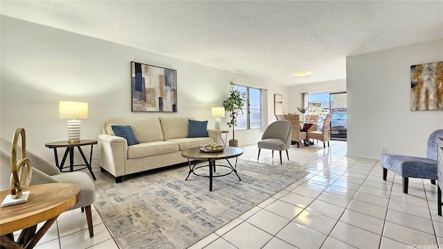living room featuring baseboards and light tile patterned floors
