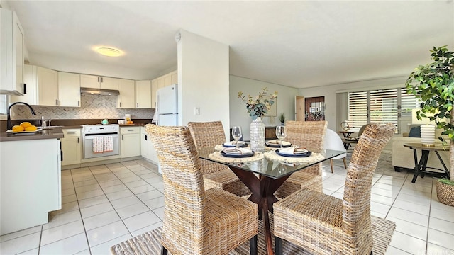 dining room featuring light tile patterned flooring