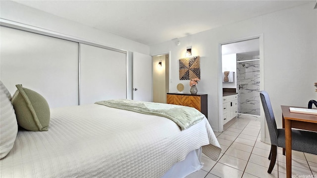 bedroom with a closet and light tile patterned floors