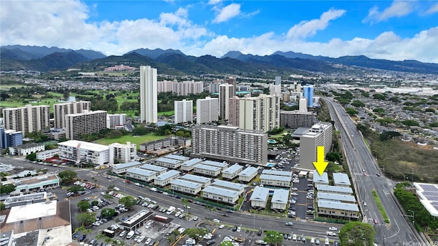 birds eye view of property featuring a view of city and a mountain view