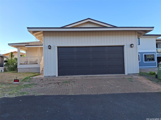 view of front facade featuring an attached garage and decorative driveway