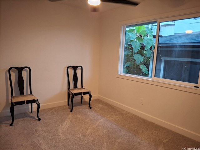 unfurnished room featuring carpet, baseboards, and ceiling fan