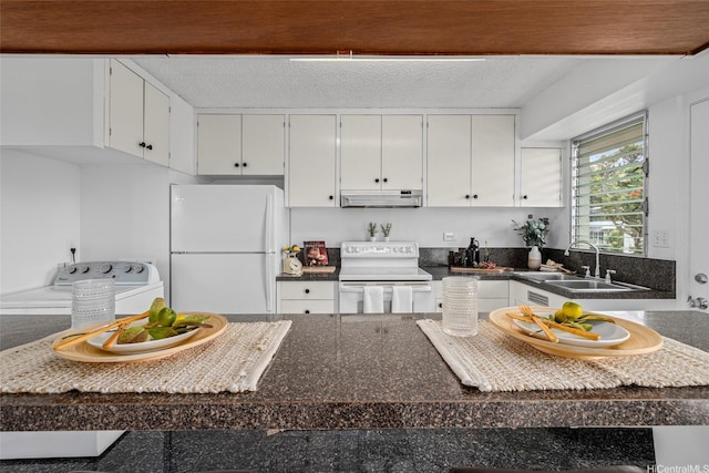 3350 Sierra Dr Unit 601, Honolulu, HI 96816 - kitchen featuring a sink, dark countertops, white appliances, under cabinet range hood, and washer / dryer