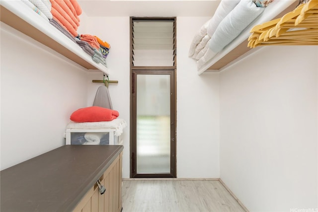 spacious closet featuring light wood-type flooring