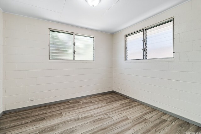 1727 Ema Pl, Honolulu, HI 96819 - empty room featuring wood finished floors and baseboards