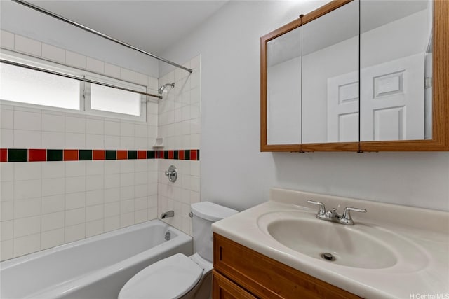bathroom featuring toilet, bathtub / shower combination, and vanity