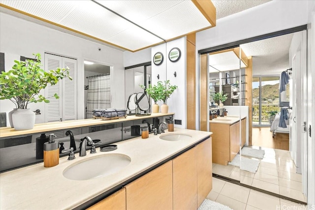 1212 Nuuanu Ave Unit 1306, Honolulu, HI 96817 - full bathroom with tile patterned flooring and double vanity