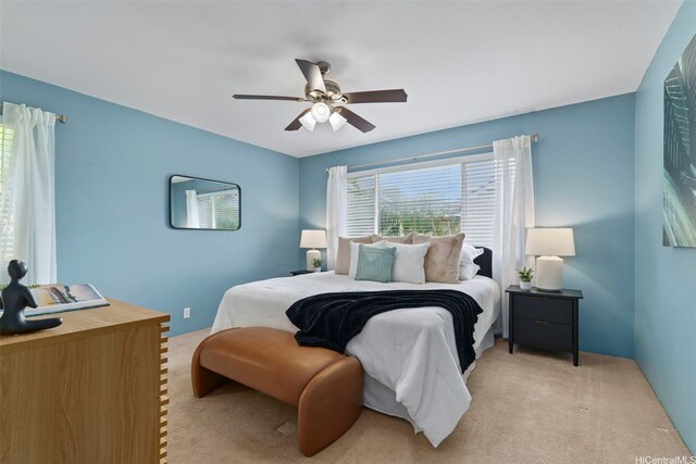 bedroom with light carpet and ceiling fan