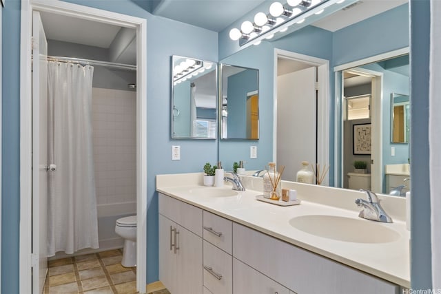 bathroom with toilet, double vanity, and shower / tub combo