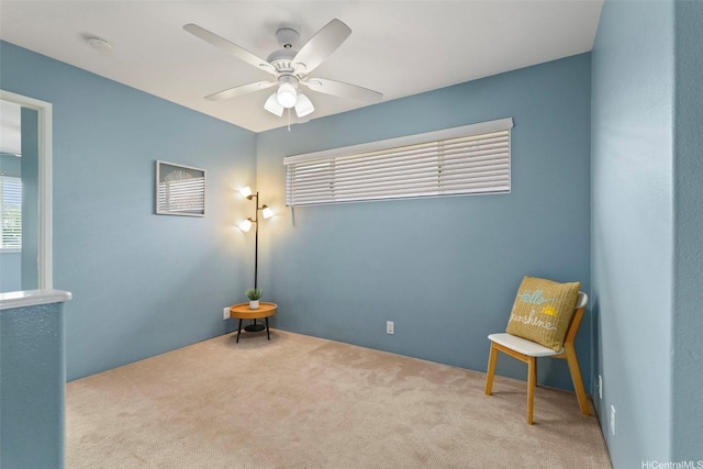 unfurnished room with plenty of natural light, carpet, and ceiling fan