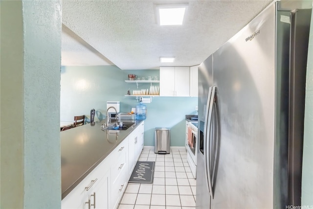 kitchen with a sink, light tile patterned floors, open shelves, a textured ceiling, and stainless steel fridge with ice dispenser