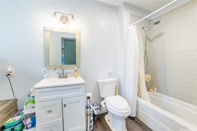 bathroom featuring shower / bathtub combination with curtain, wood finished floors, toilet, and vanity