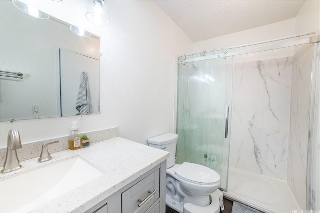 full bathroom with toilet, a marble finish shower, and vanity