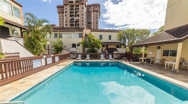 pool with a patio area