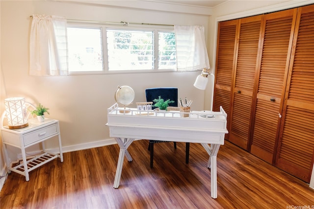 home office with wood finished floors and baseboards