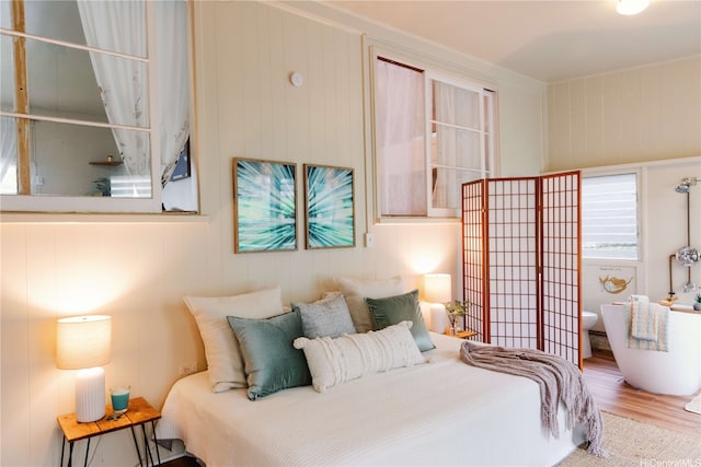 bedroom with wood finished floors