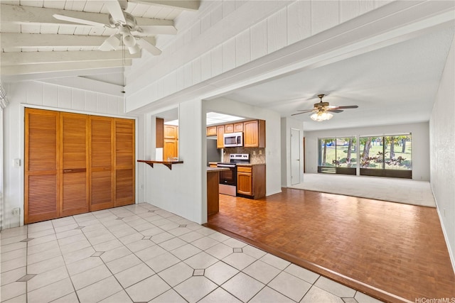 98-1724 Kaahumanu St Unit 16C, Pearl City, HI 96782 - unfurnished living room featuring lofted ceiling with beams and a ceiling fan