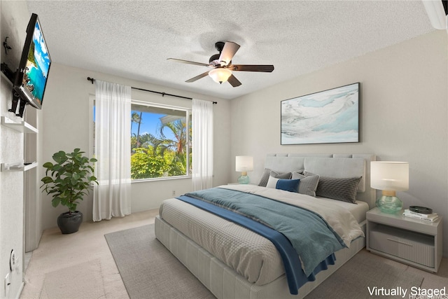 98-1724 Kaahumanu St Unit 16C, Pearl City, HI 96782 - carpeted bedroom with a textured ceiling and ceiling fan
