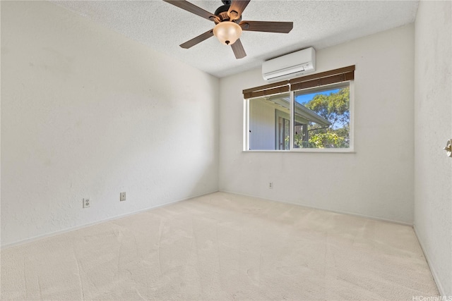98-1724 Kaahumanu St Unit 16C, Pearl City, HI 96782 - carpeted empty room with a ceiling fan, a wall unit AC, and a textured ceiling