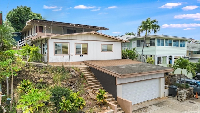 exterior space with stairway and driveway