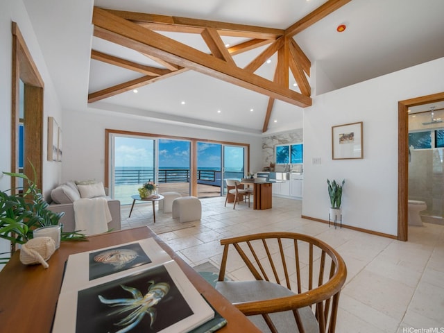 living area with high vaulted ceiling, baseboards, light tile patterned flooring, and beamed ceiling
