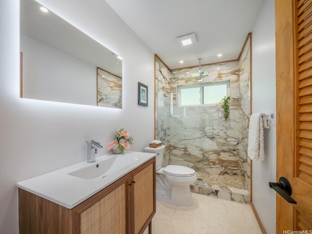 full bath with toilet, vanity, a marble finish shower, and recessed lighting