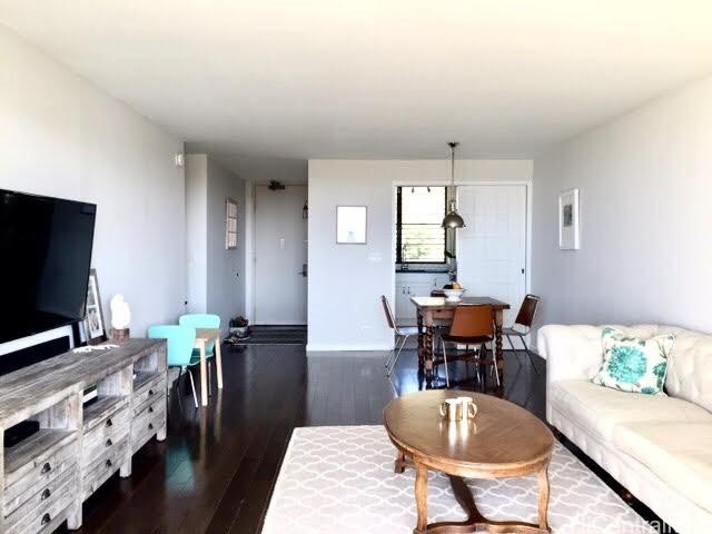 6770 Hawaii Kai Dr Unit 905, Honolulu, HI 96825 - living room featuring dark wood-style floors and baseboards