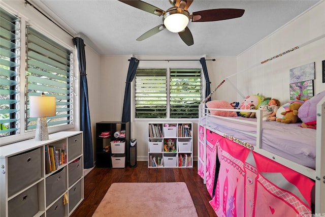 bedroom featuring a ceiling fan and hardwood / wood-style floors