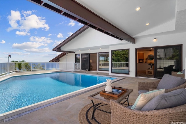 view of swimming pool featuring fence, a patio, and a fenced in pool