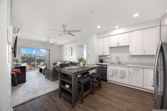 91-3525 Kauluakoko St Unit 2014, Ewa Beach, HI 96706 - kitchen with a sink, stainless steel appliances, open floor plan, dark wood-type flooring, and white cabinetry