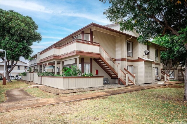 91-568 Puamaeole St Unit 50T, Ewa Beach, HI 96706 - back of property with stairs and a lawn