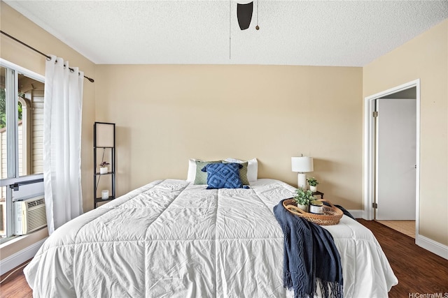 91-568 Puamaeole St Unit 50T, Ewa Beach, HI 96706 - bedroom featuring wood finished floors, a textured ceiling, baseboards, ceiling fan, and cooling unit