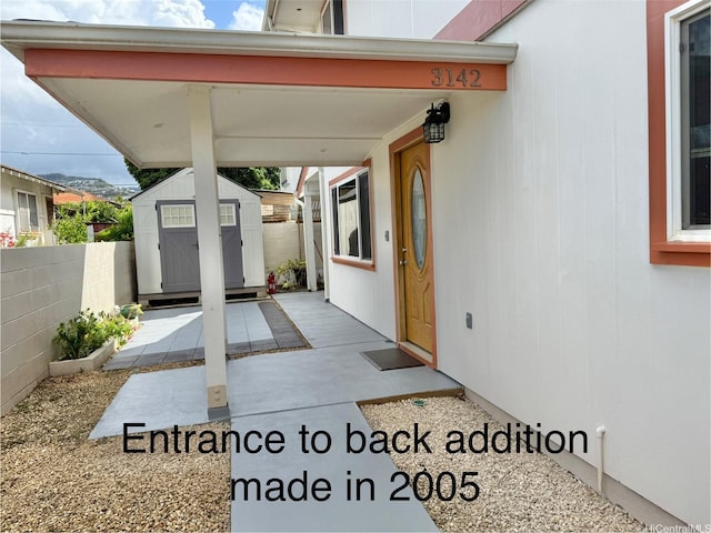 3142 Olu St, Honolulu, HI 96816 - view of patio / terrace with a storage unit, fence, and an outbuilding