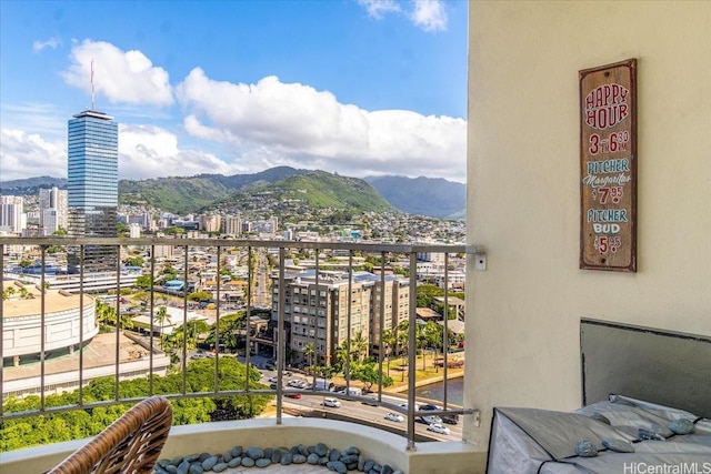 balcony with a view of city and a mountain view