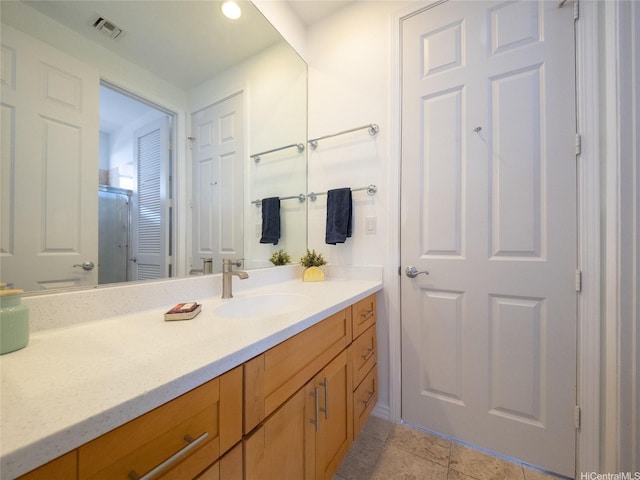bathroom featuring vanity and visible vents