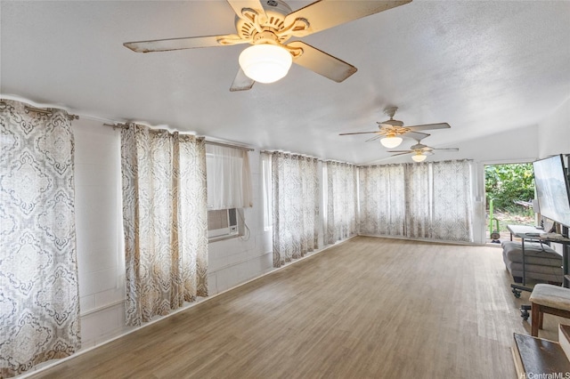 91-688 Kilinahe St, Ewa Beach, HI 96706 - unfurnished living room featuring a ceiling fan, wood finished floors, and cooling unit