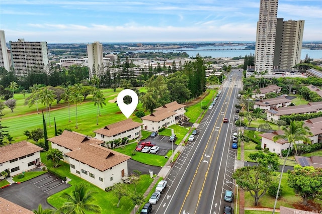 bird's eye view featuring a view of city and a water view