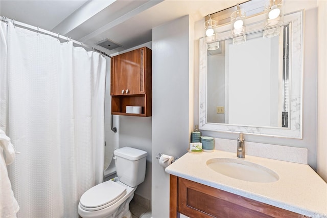 bathroom with vanity, toilet, and a shower with curtain