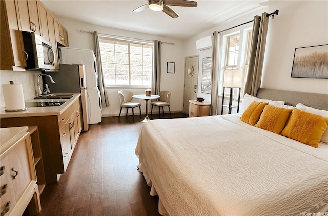 84-928 Maiola St Unit 76, Waianae, HI 96792 - bedroom featuring a wall mounted AC, a sink, and dark wood-type flooring