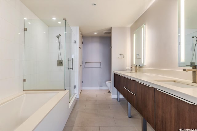 full bathroom with tile patterned floors, a sink, double vanity, toilet, and a shower stall