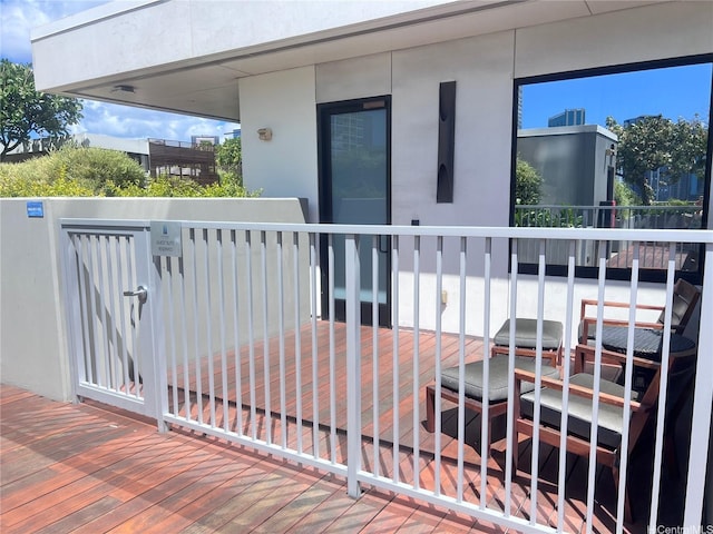 exterior space featuring fence and a deck