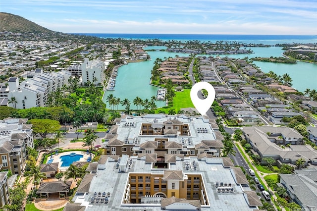 birds eye view of property with a water view and a residential view