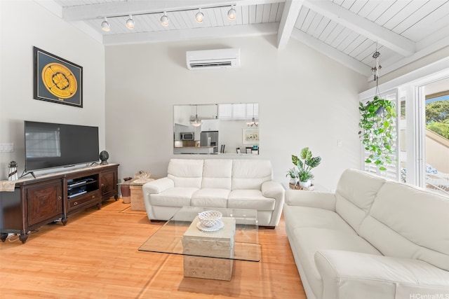 44-3612 Nilu St Unit 9/2, Kaneohe, HI 96744 - living area with light wood-style flooring, a wall mounted air conditioner, high vaulted ceiling, and wooden ceiling with exposed beams