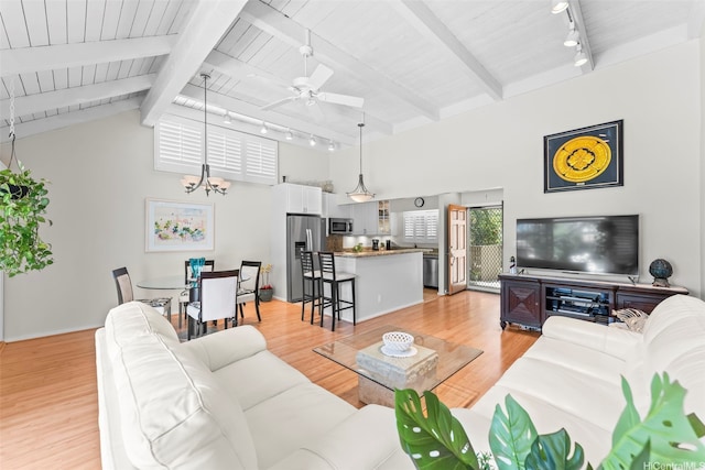 44-3612 Nilu St Unit 9/2, Kaneohe, HI 96744 - living room with rail lighting, a ceiling fan, wooden ceiling, light wood-type flooring, and a chandelier