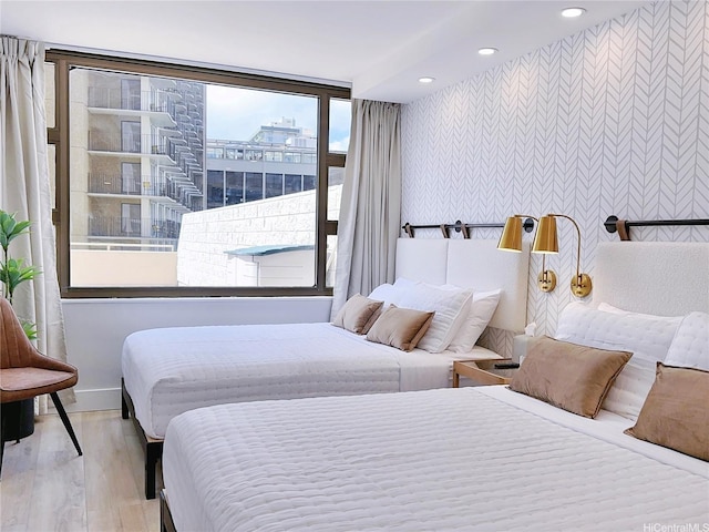 201 Ohua Ave Unit 610, Honolulu, HI 96815 - bedroom with baseboards, wood finished floors, recessed lighting, and wallpapered walls