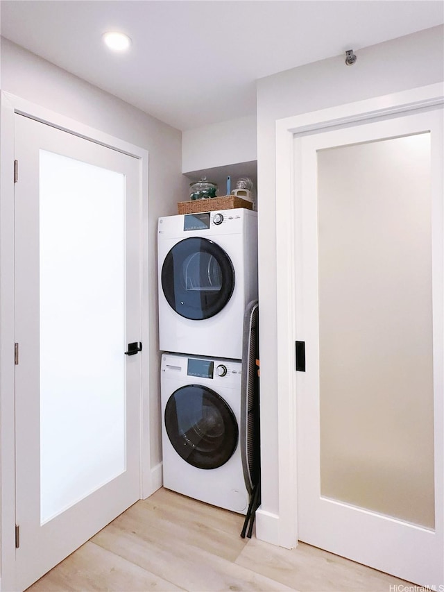 201 Ohua Ave Unit 610, Honolulu, HI 96815 - laundry room featuring recessed lighting, light wood-style flooring, stacked washer / dryer, and laundry area