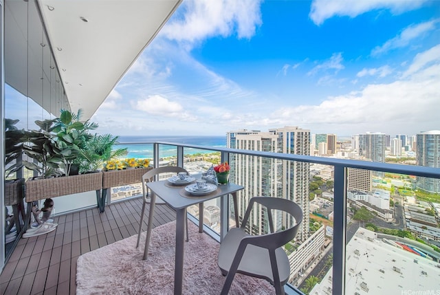 balcony with a city view and a water view