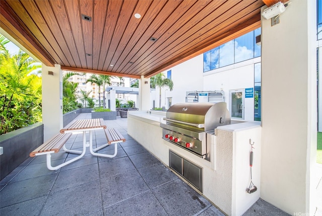 view of patio with an outdoor kitchen and grilling area